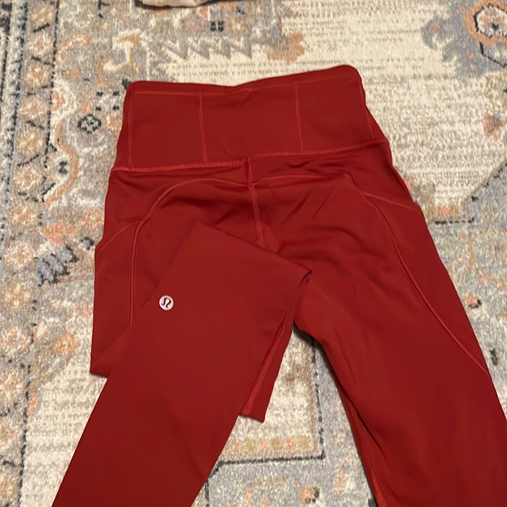 Size 2 Lululemon petite length. Rust red color.